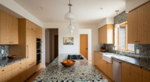 Sustainable kitchen remodel 2025 with recycled glass counters and bamboo cabinets