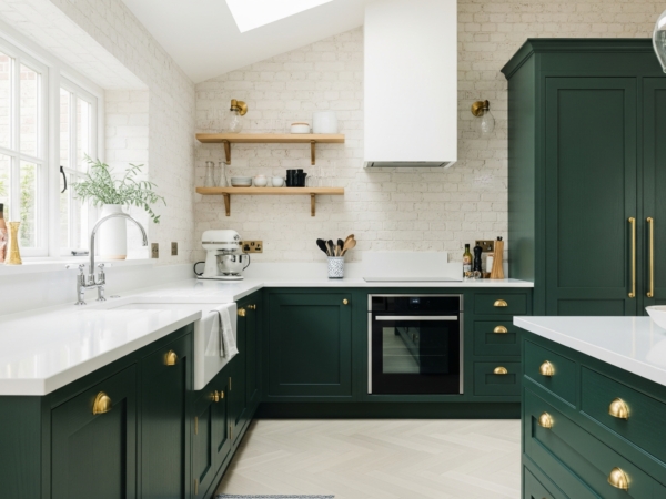 Kitchen remodel 2025 trend with green cabinets and brass hardware