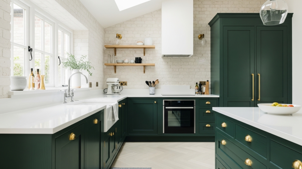 Kitchen remodel 2025 trend with green cabinets and brass hardware